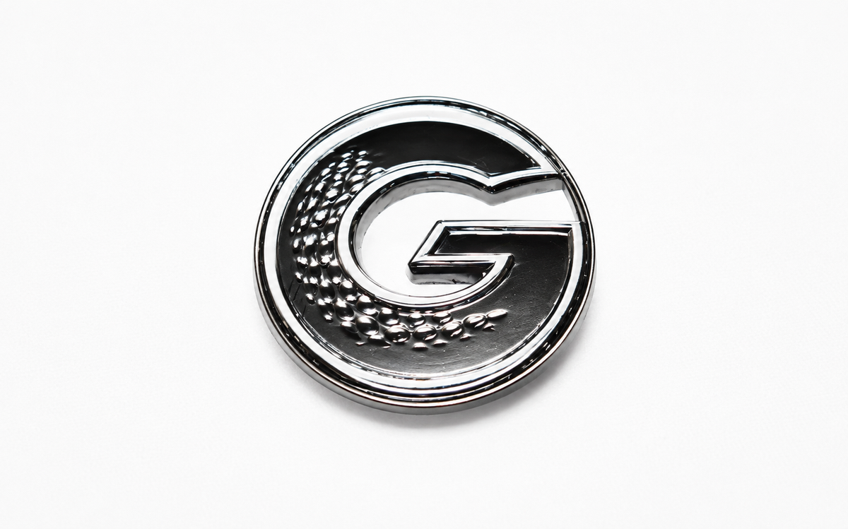 G•MARK Black with White Trim magnetic golf ball marker, front view