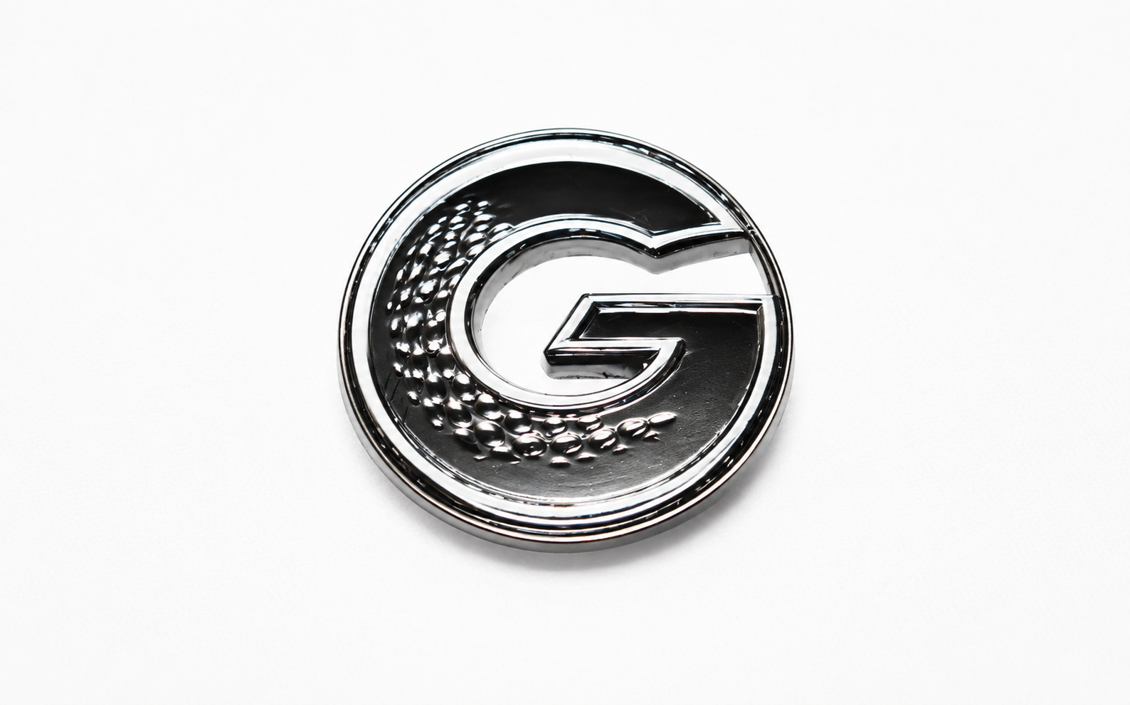 G•MARK Black with White Trim magnetic golf ball marker, front view