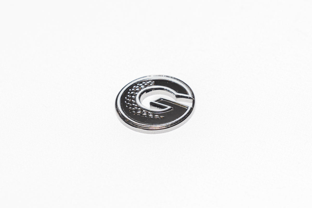 G•MARK Black with White Trim magnetic golf ball marker, close-up detail